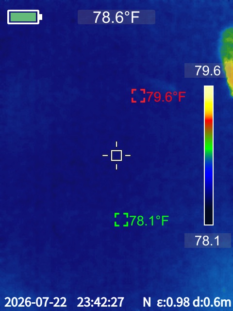 Infrared thermal camera screen showing temperature readings pinpointing a hot water slab leak
